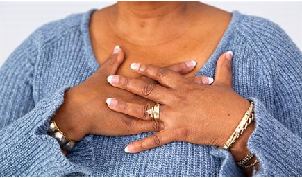 image of a woman having heartburn